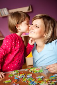 mom-doing-puzzle-with-daughter