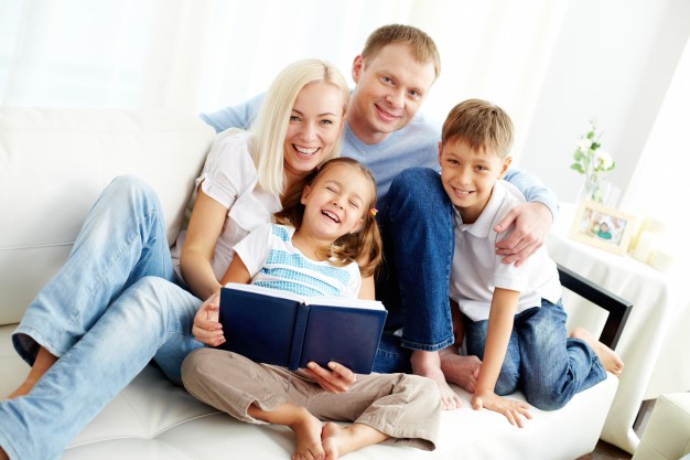 happy-family-reading-a-book_1098-1493